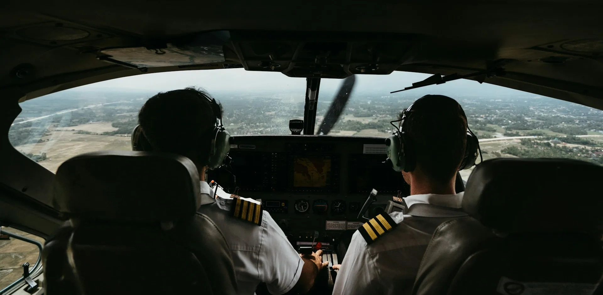 Two pilots flying a NextGen training aircraft over the Los Angeles basin